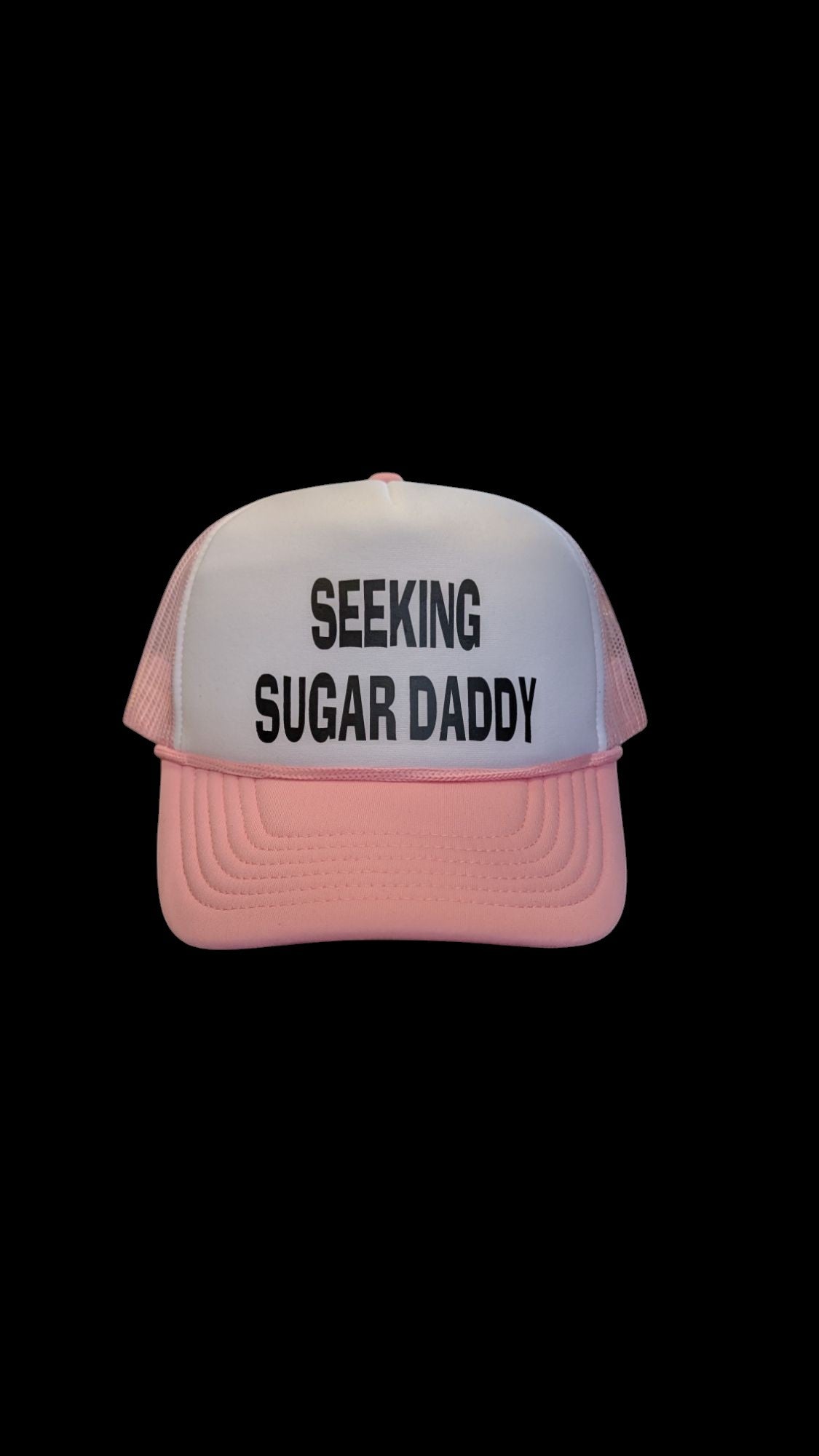 Lakelifewear pink and white foam trucker hat with Seeking Sugar Daddy slogan in black lettering and rope detail